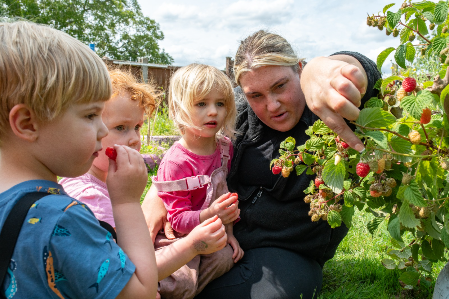 Ruddington staff member and children outside.