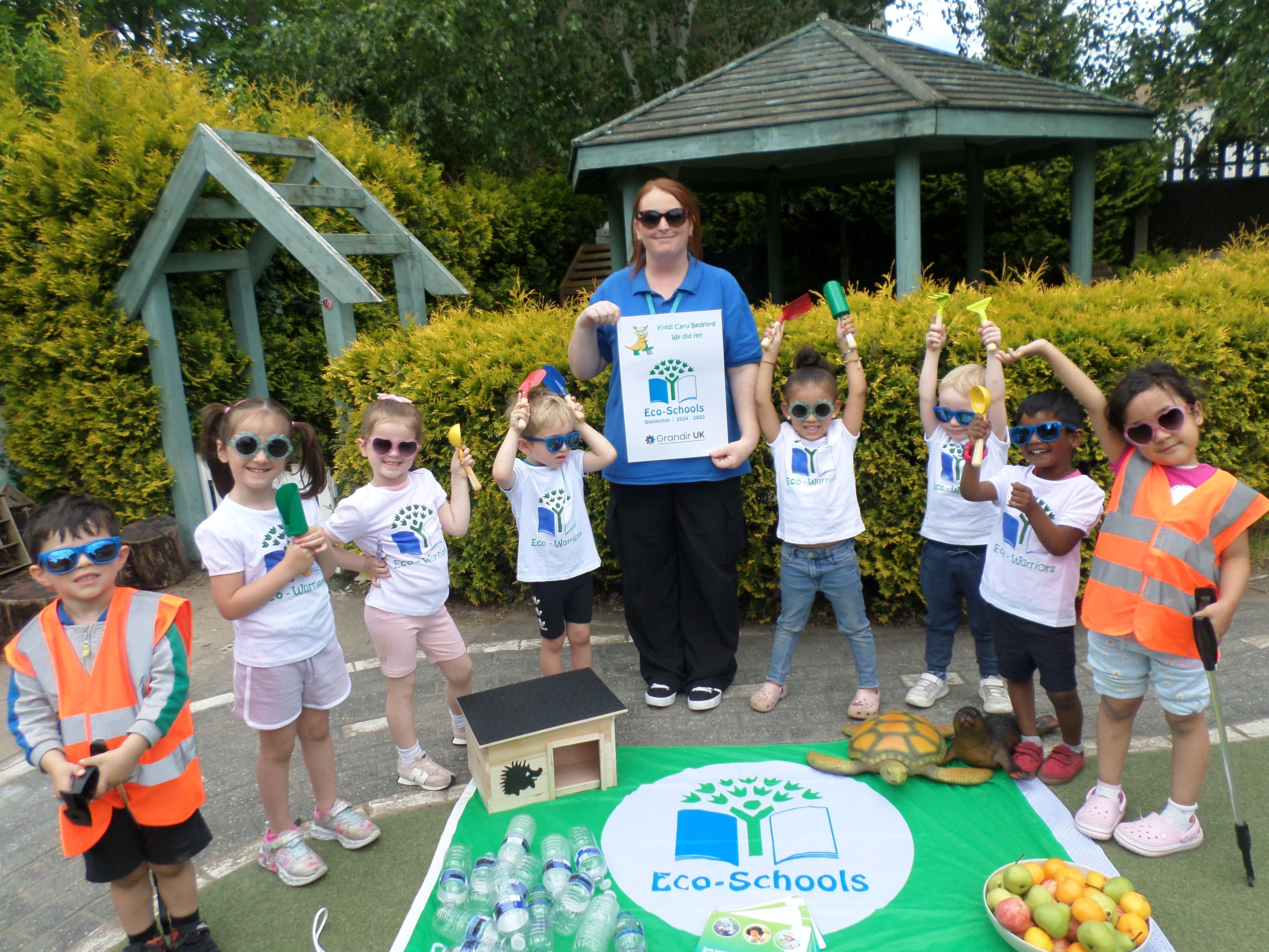 Kiddi Caru Day Nursery in Bedford celebrating their Eco Schools Green Flag Award.