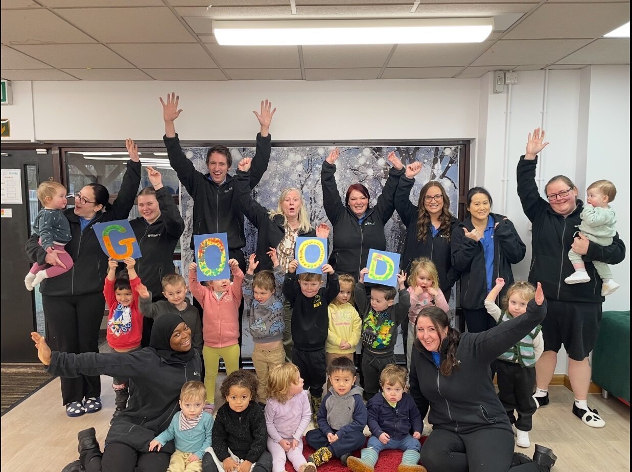 The children and team at Kiddi Caru Day Nursery & Preschool on Great Park Road, Bradley Stoke, Bristol celebrating their 'Good' Ofsted rating.