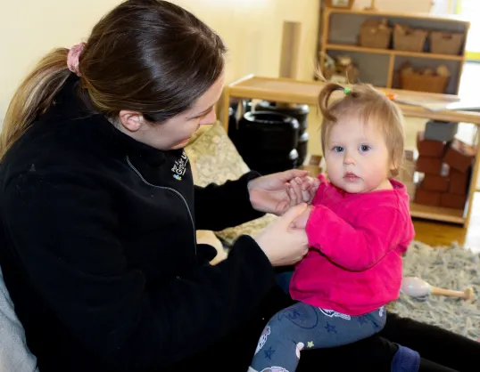 Child with key worker at Kiddi Caru Sowton Exeter