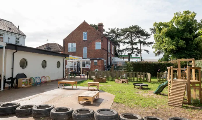 Bright interactive outdoor activity space at The Laurels Day Nursery Preschool Queniborough