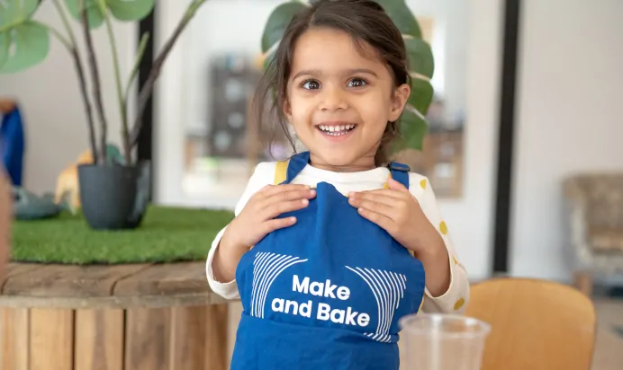 Child laughing at The Kiddi Caru Day Nursery Preschool Grange Park