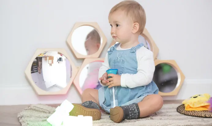Child sitting in interactive space at The Kiddi Caru Day Nursery Preschool Basingstoke