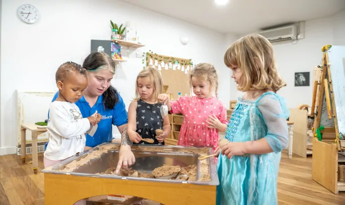 Children collaborating in interactive space at The Kiddi Caru Day Nursery Preschool Burgess Hill