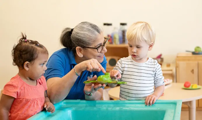 Children learning with key worker at The Kiddi Caru Day Nursery Preschool Taunton
