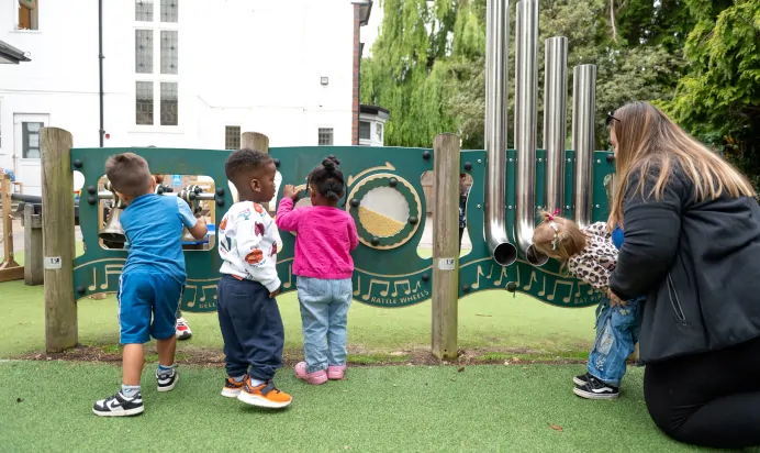 children-playing-outside-making-music-with-key-worker-at-little-acorns-day-nursery-preschool-stoneygate-692x412.webp Children playing outside making music with key worker at Little Acorns Day Nursery Preschool Stoneygate