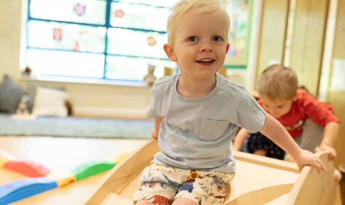 Children playing together in interactive space at The Kiddi Caru Day Nursery Preschool Taunton