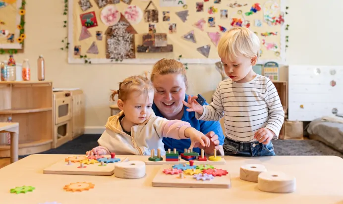 Children playing with key worker at The Kiddi Caru Day Nursery Preschool Taunton