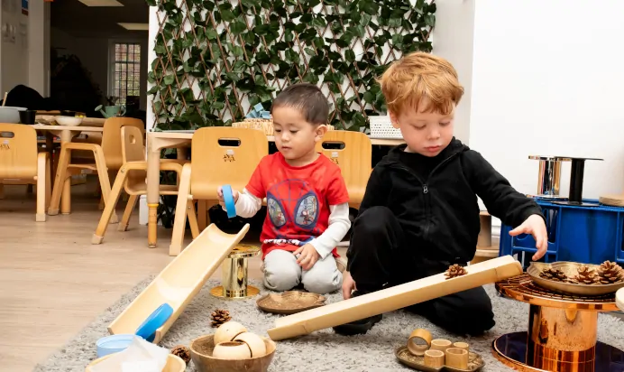 Children playing with pinecones at Little Acorns Day Nursery Preschool Stoneygate