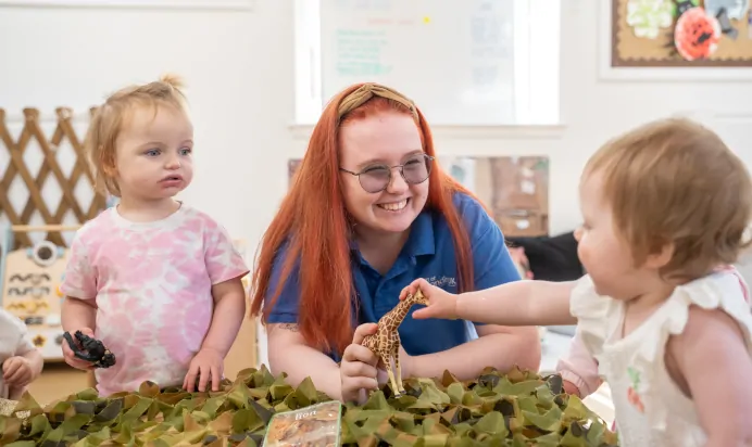 Children playing with toy animals at The Old Barn Day Nursery Preschool Narborough