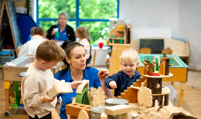 Children playing with wooden toys at Kiddi Caru Day Nursery Preschool Plympton Plymouth