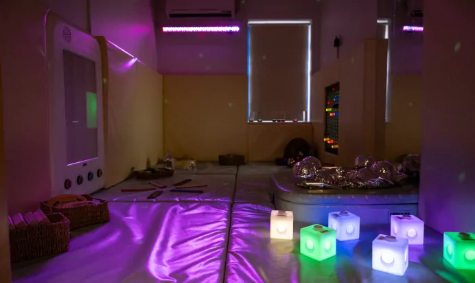 Indoor area with play mats and glowing blocks at Kiddi Caru Day Nursery Preschool Caldecotte Milton Keynes