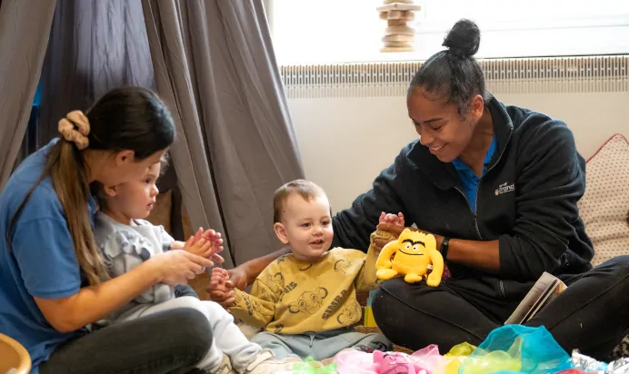 Key workers playing with children at Charnwood Day Nursery Preschool Shepshed Loughborough