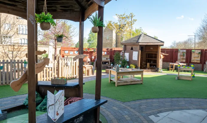 Outdoor play area with nature school at Kiddi Caru Day Nursery Preschool Caldecotte Milton Keynes