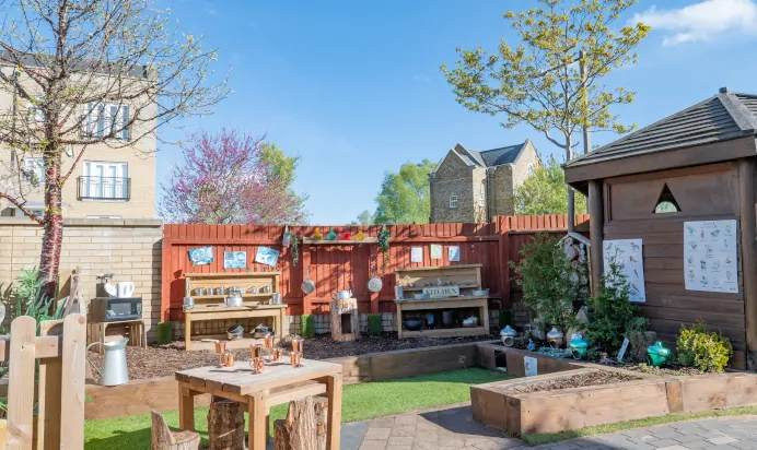 Outdoor play kitchen at Kiddi Caru Day Nursery Preschool Caldecotte Milton Keynes