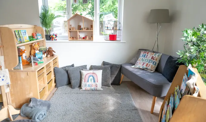 Reading corner with cushions and sofa at Little Acorns Day Nursery Preschool Stoneygate