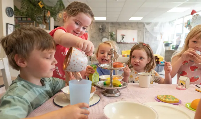 Children playing tea parties at Kiddi Caru Day Nursery Preschool Fareham