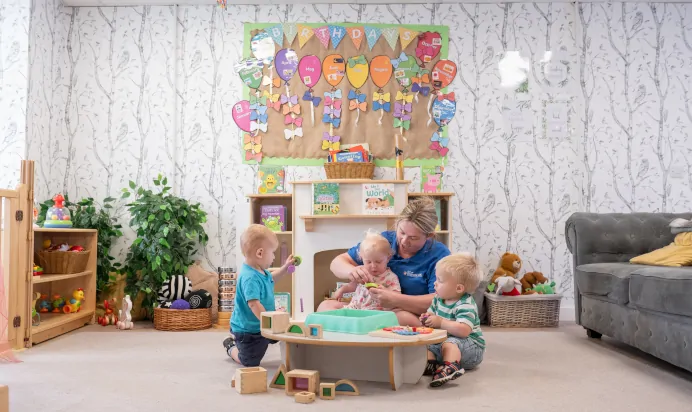 Key worker playing with children at Kiddi Caru Day Nursery Preschool Fareham