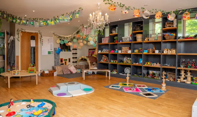 Indoor activity area with book corner and sand pit at Dicky Birds Nursery Preschool Claremont Road Surbiton