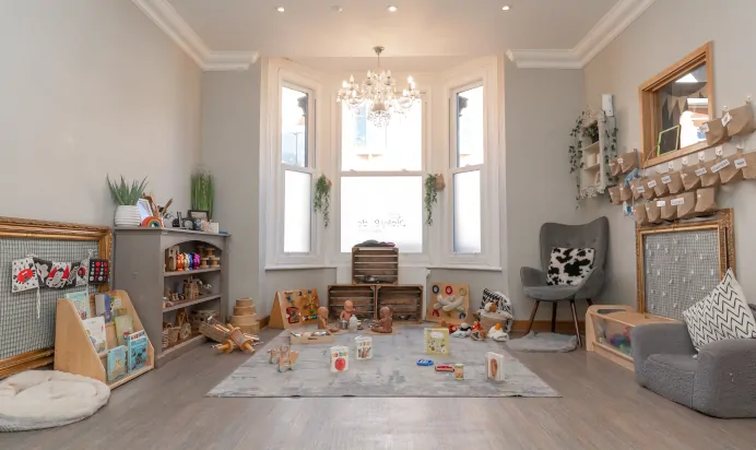 Indoor activity area with toys and books at Dicky Birds Nursery Preschool Queens Road Wimbledon London