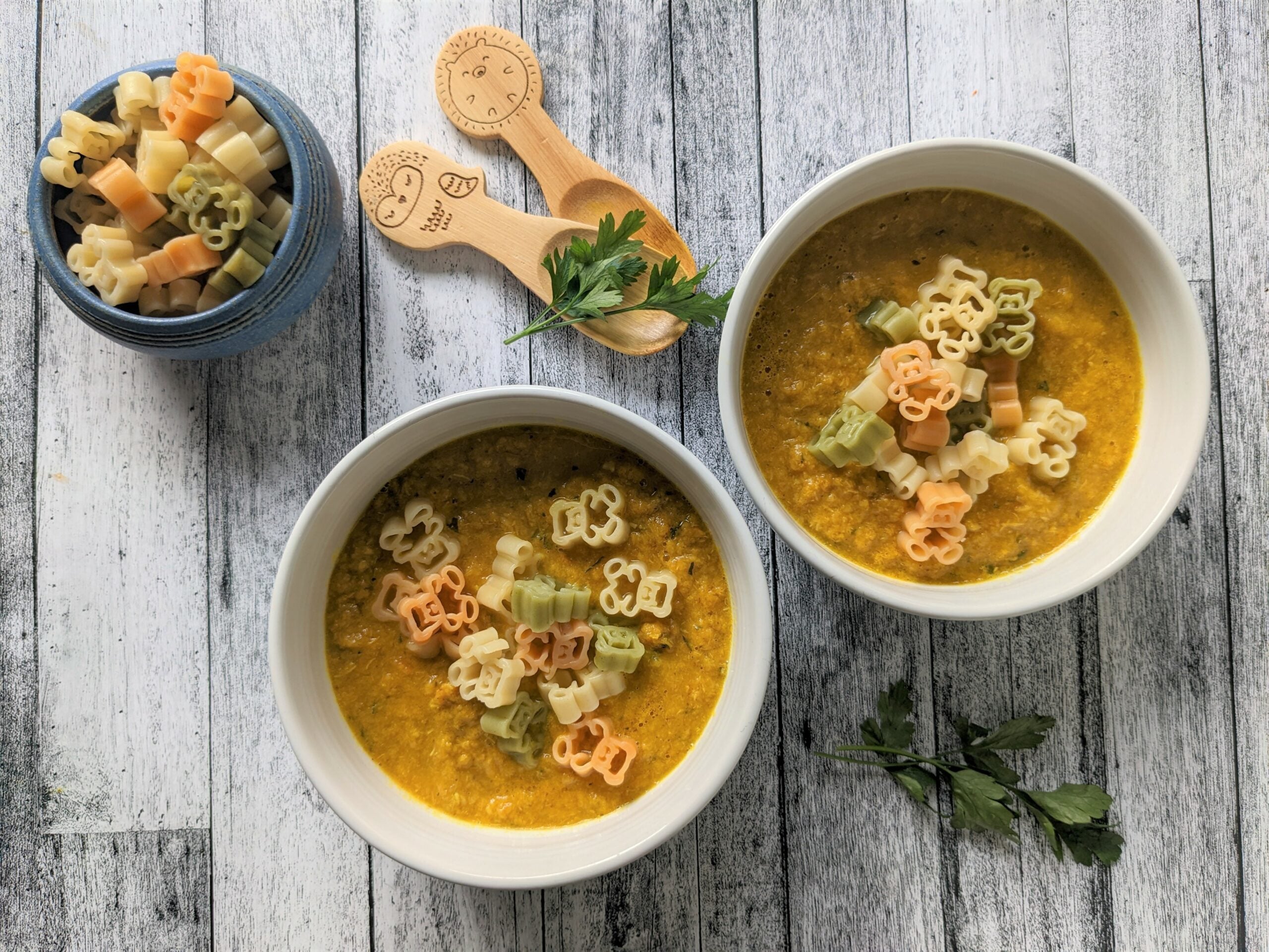 Two bowls of soup displayed on a table