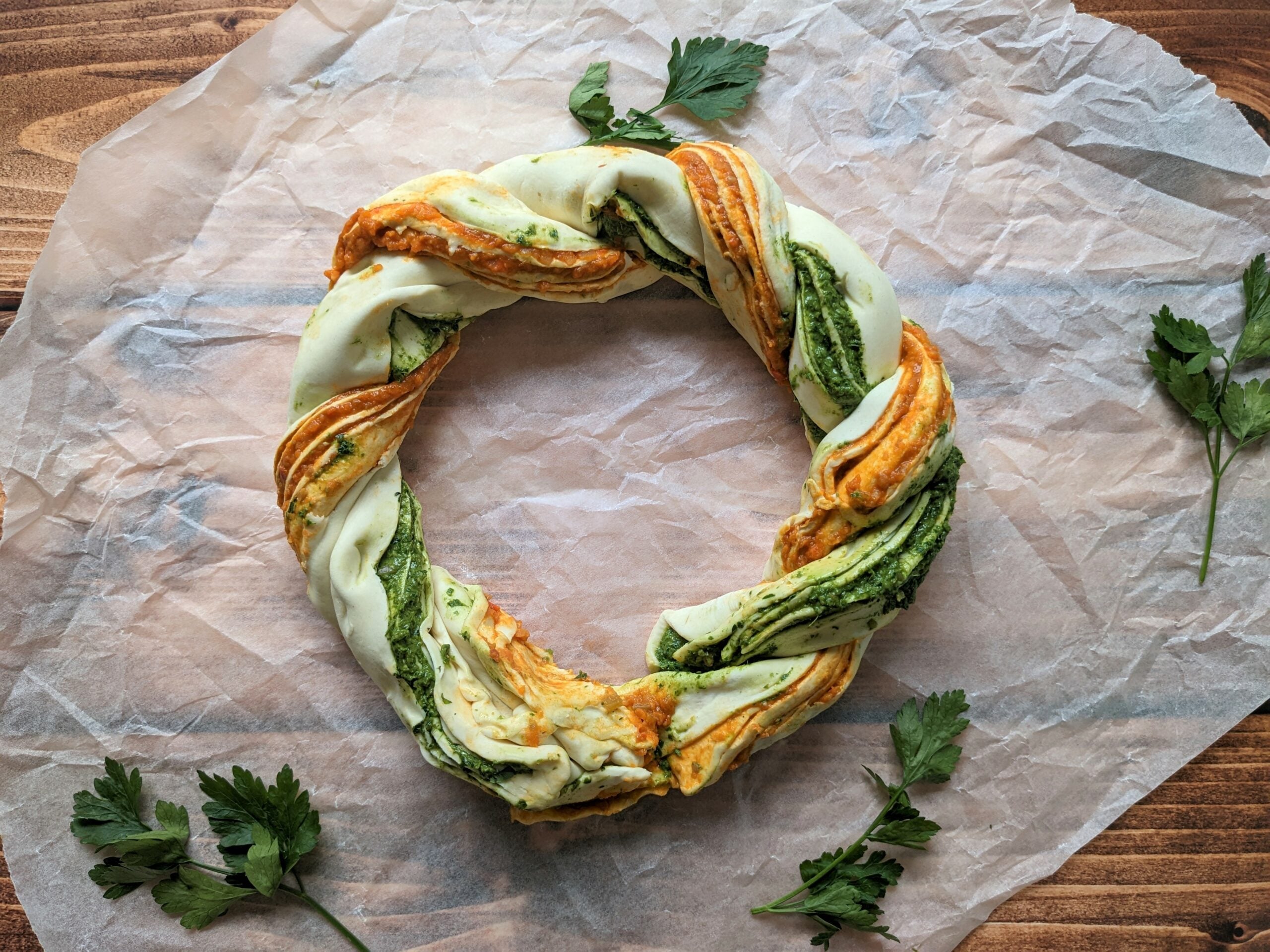 Christmas wreath pastry displayed on a baking sheet