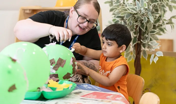 Child and key worker doing crafts at Clerkenwell Mount Day Nursery Preschool London
