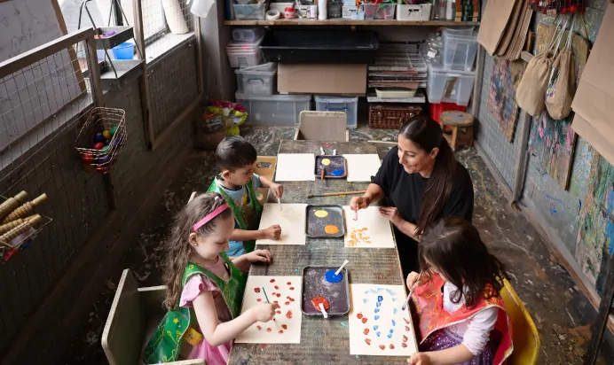 Children and key worker doing art at The Chiswick House Day Nursery Preschool London