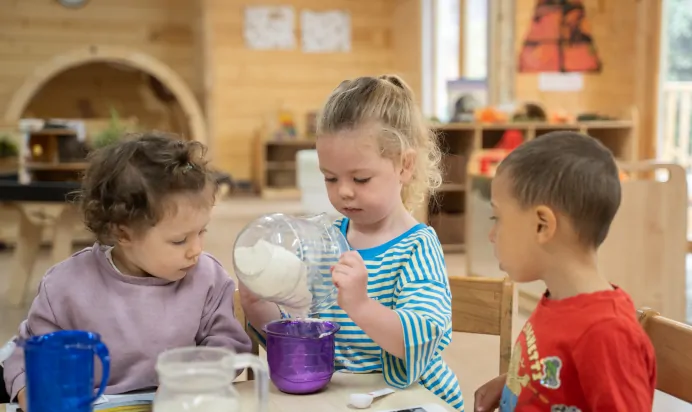 Children baking in kitchen at The Chingford Forest Day Nursery Preschool London