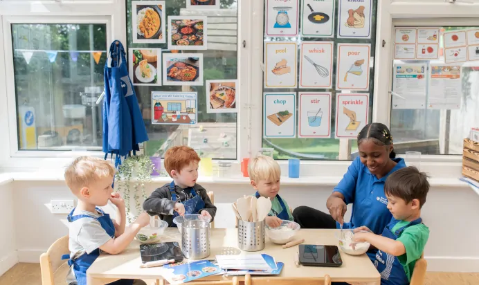 Children baking with key worker at The Penge East Day Nursery Preschool London