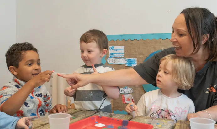 Children painting together at The Penge East Day Nursery Preschool London