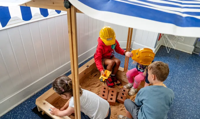 Children play in sandpit at Radcliffe On Trent Day Nursery Preschool
