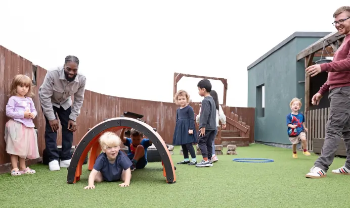 Children playing outside at The Chiswick House Day Nursery Preschool London