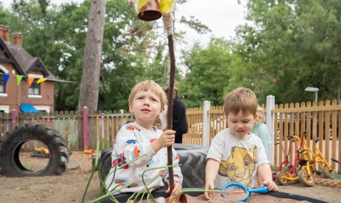 Children playing outside together at The Chingford Forest Day Nursery Preschool London