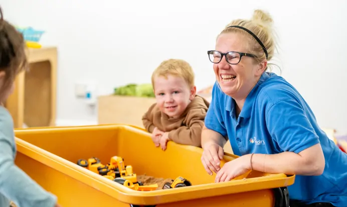 Children playing with a key worker at Radcliffe On Trent Day Nursery Preschool