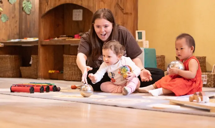 Children playing with key worker at The Kensington Place Nursery Preschool London