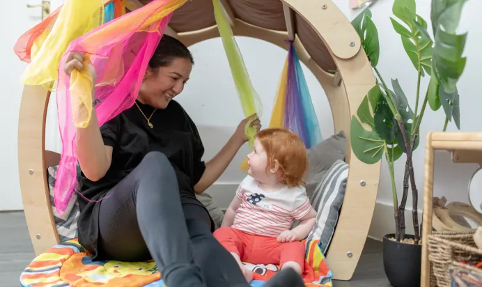 Children playing with key worker at The Penge East Day Nursery Preschool London