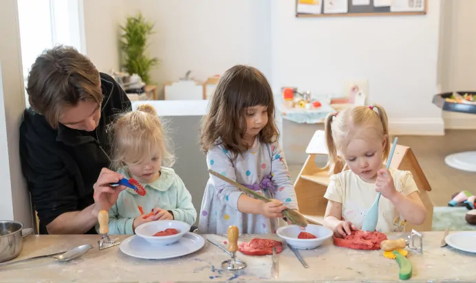 Children playing with playdough at The Ryan House Day Nursery Preschool Nottingham