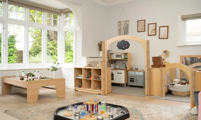 Indoor play area with play kitchen at The Daydream Nursery Preschool Woking