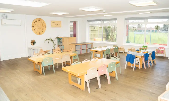 Inside space with tables and chairs at The Ryan House Day Nursery Preschool Nottingham