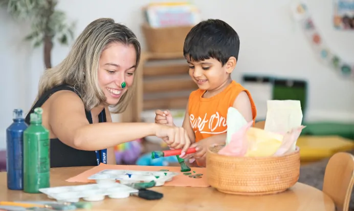 Key worker and child painting at Clerkenwell Mount Day Nursery Preschool London