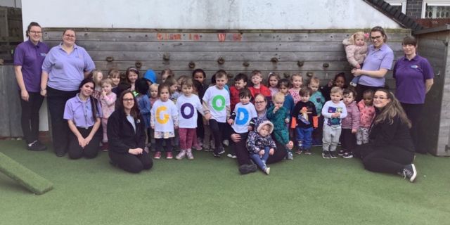 The children and staff at Kiddi Caru Day Nursery in Peterborough celebrating their ‘Good’ Ofsted rating from their February 2023 inspection.