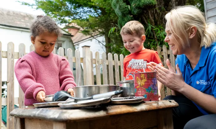 Key worker clapping for children at The Wishing Tree Nursery Preschool Brighton