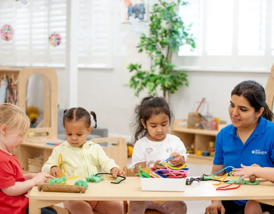 Three children engaged in an activity