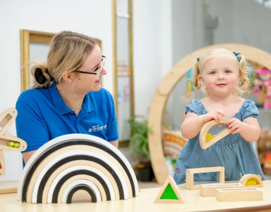Child playing with shapes