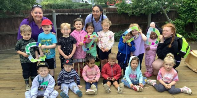 The team and children at Kiddi Caru Day Nursery in Wellingborough celebrating their Ofsted ‘Good’ grading.