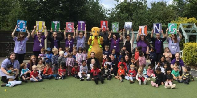 The children and staff at Kiddi Caru Day Nursery in Bedford celebrating their ‘Outstanding’ Ofsted rating.