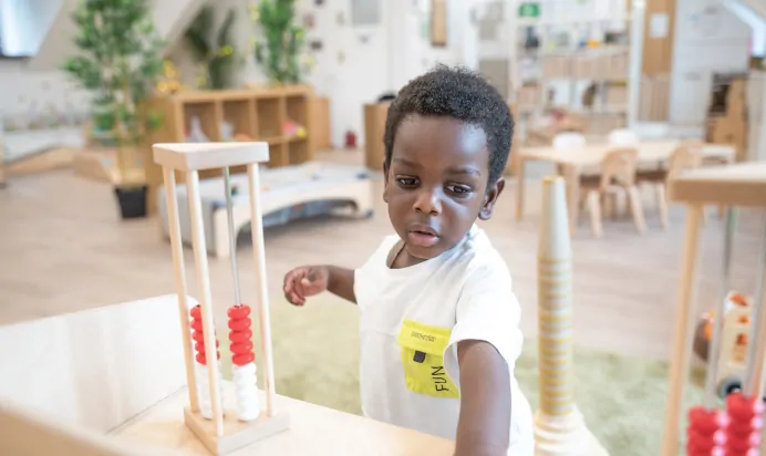 Child having fun at Kiddi Caru Day Nursery Preschool Webbs Wood Road Bradley Stoke Bristol