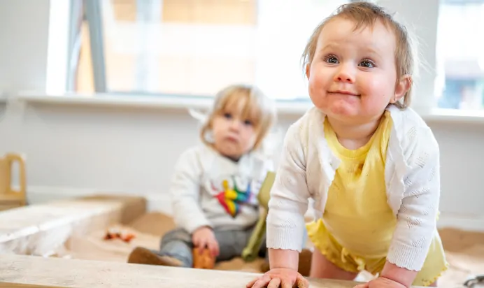 Children playing in the sandpit at Kiddi Caru Day Nursery Preschool Soundwell Bristol