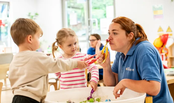 Children playing with key worker at Kiddi Caru Day Nursery Preschool Soundwell Bristol